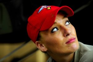 woman in red cap looking up to ask where was God when I was abused