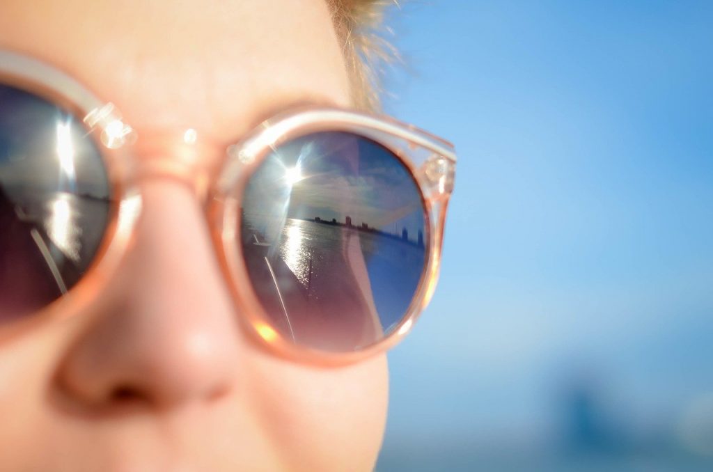 girl wearing reflective sunglasses